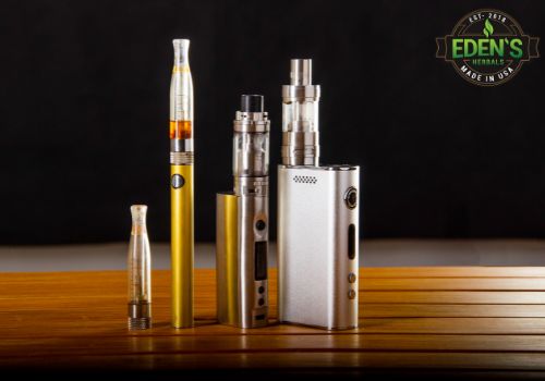 different types of CBD vapes lined up on a table